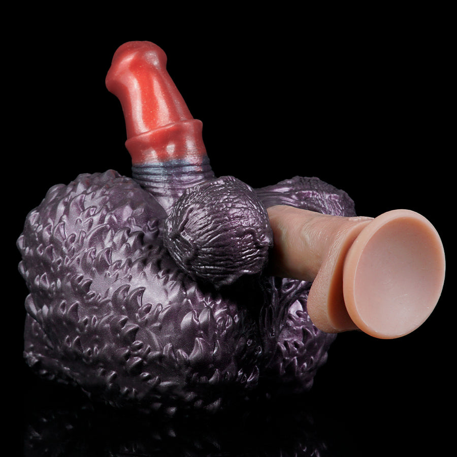 Purple textured hand-shaped toy with red finger and raised red horn on top.