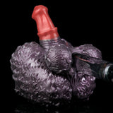 Purple textured hand-shaped toy with red horn and translucent accessory on the right.