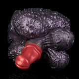 Purple textured creature toy with red heart-shaped front detail and curled claw shapes.