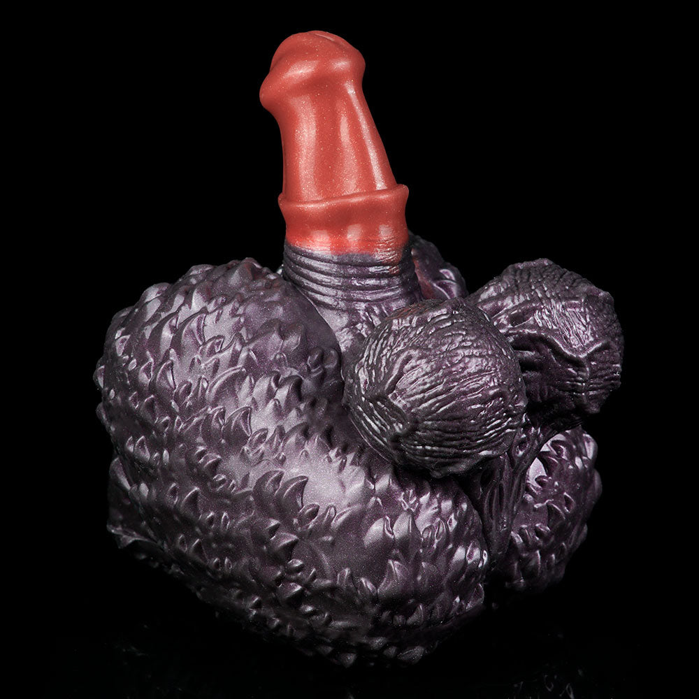Purple textured hand-shaped toy with red horn and detailed knuckle and finger ridges.