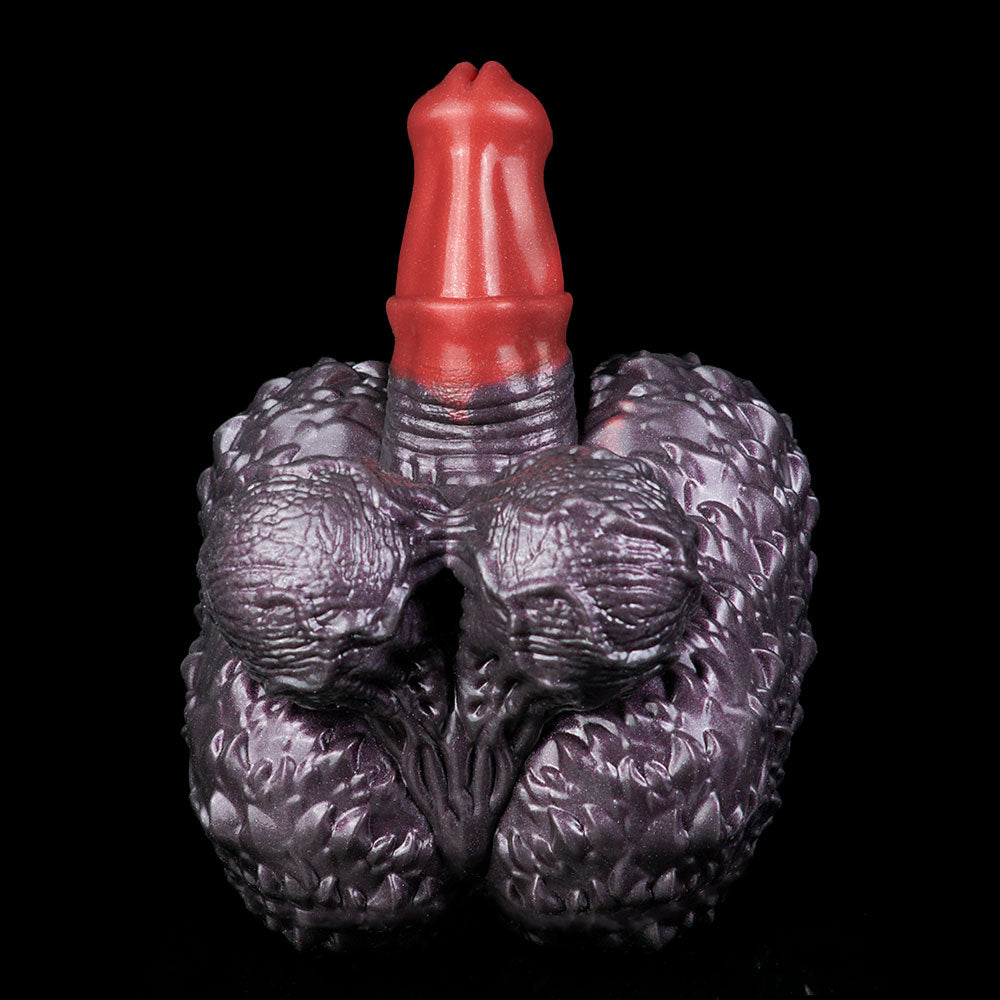 Purple textured hand-shaped toy front view with red horn in the center.