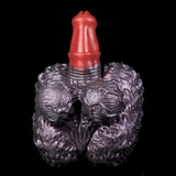 Purple textured hand-shaped toy front view with red horn in the center.