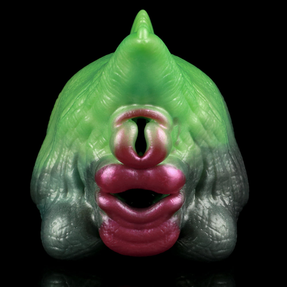 Drachen-Masturbator Vorderansicht: grüner Kopf mit rotem Mund und sichtbarer Öffnung