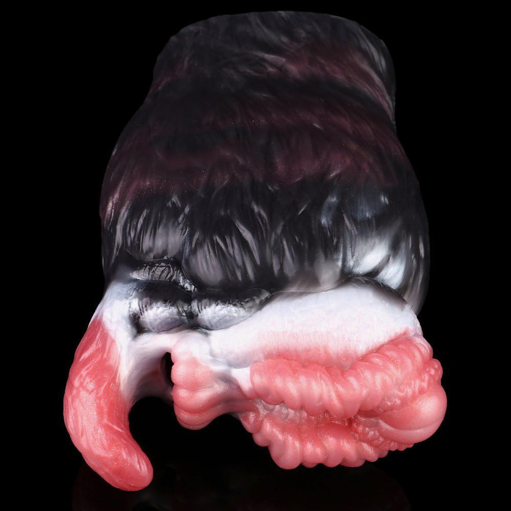 Close-up of dual-hole creature toy: black fur exterior with pink ribbed openings
