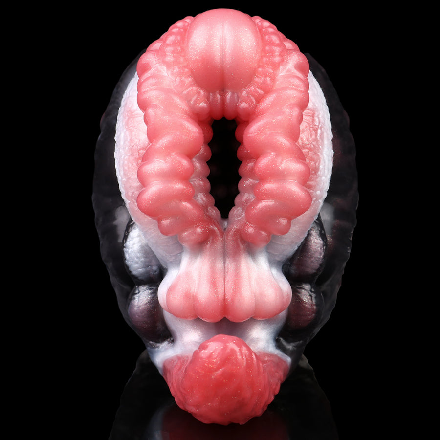 Dual-hole creature masturbator with pink inner ring opening and dark furry exterior