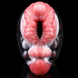 Front view dual-hole creature toy with two pink ribbed openings on black-and-white body