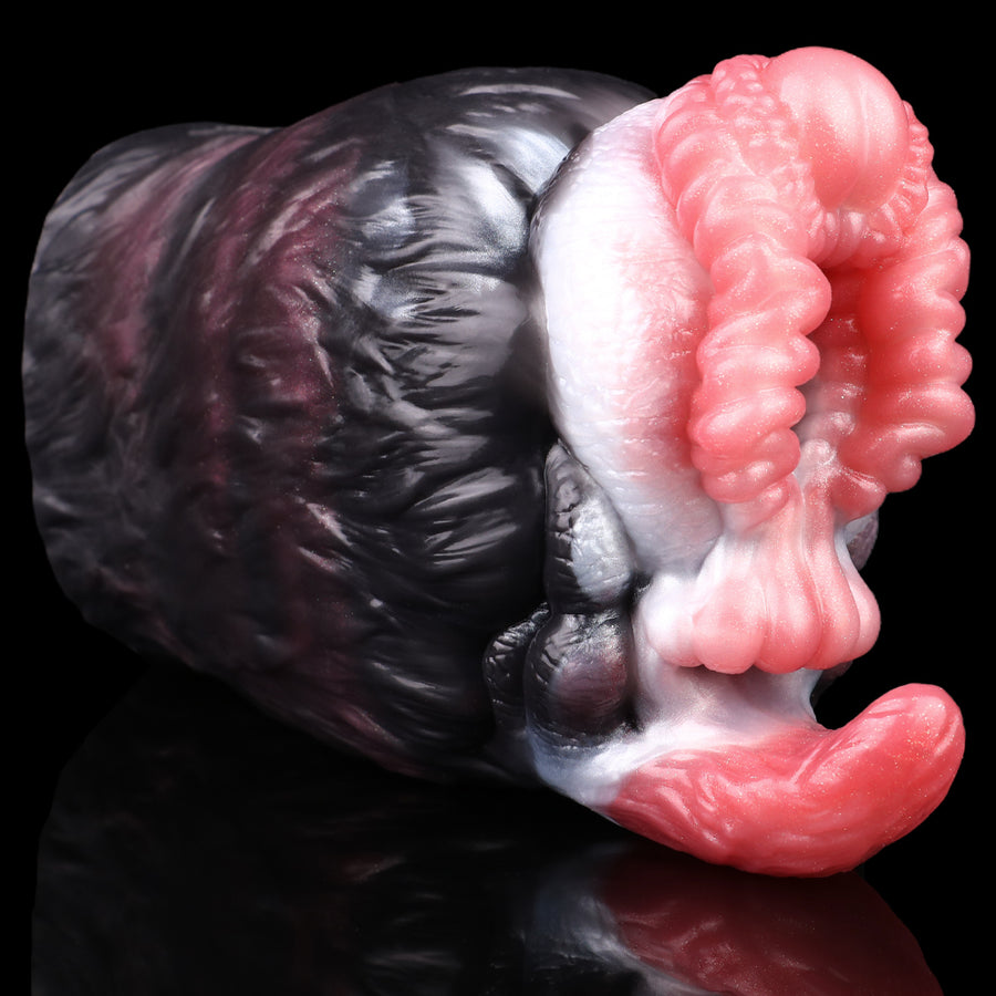 Dual-hole creature masturbator side view with dark fur pattern and pink ribbed insert