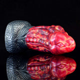 Dragon butt plug with face-like head, red-blue swirl design and dark textured base