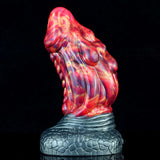 Dragon butt plug with red-blue patterned body and dark textured base, back view