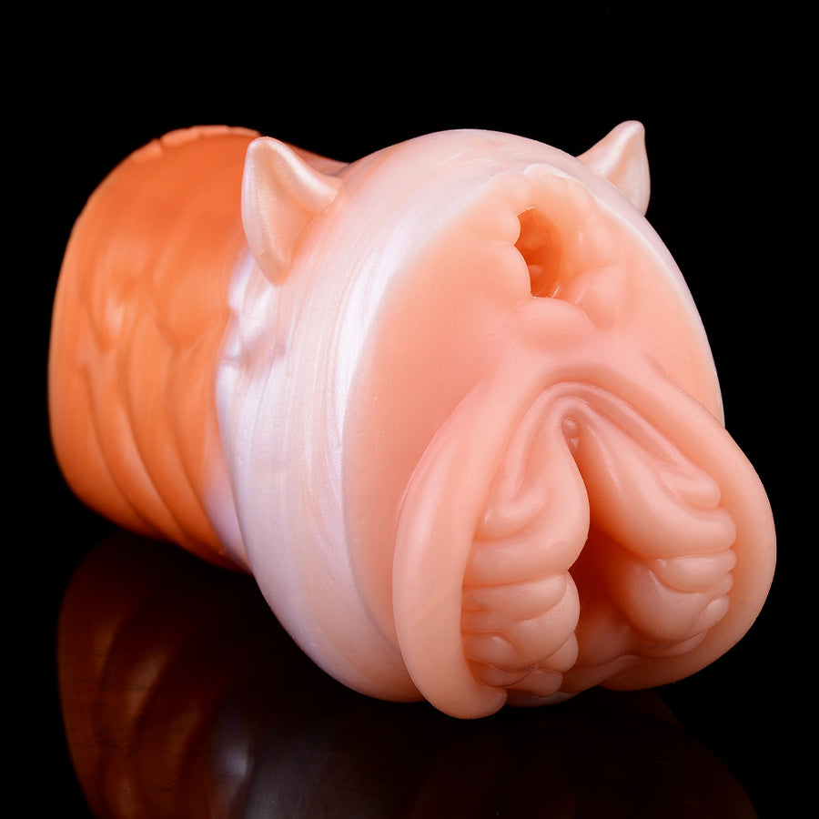 Orange and pale peach fantasy stroker with raised molded details and animal ear shapes.