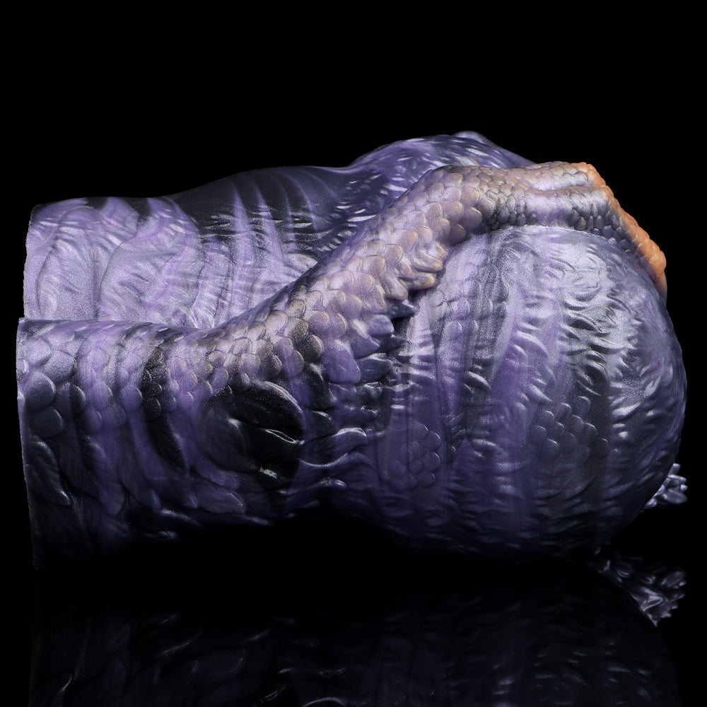 Animal-themed dual-hole fleshlight in profile with scaly embossed texture on body