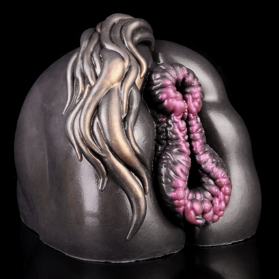 Two-hole fantasy sex toy close-up, dark outer shell with pink textured interior