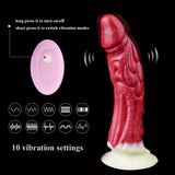 Haku Vibrator mit rot strukturierter Drachenform; Bedienelement auf hellen Steuer-Disc