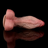 Skin-tone dildo side profile with textured contours and flared base