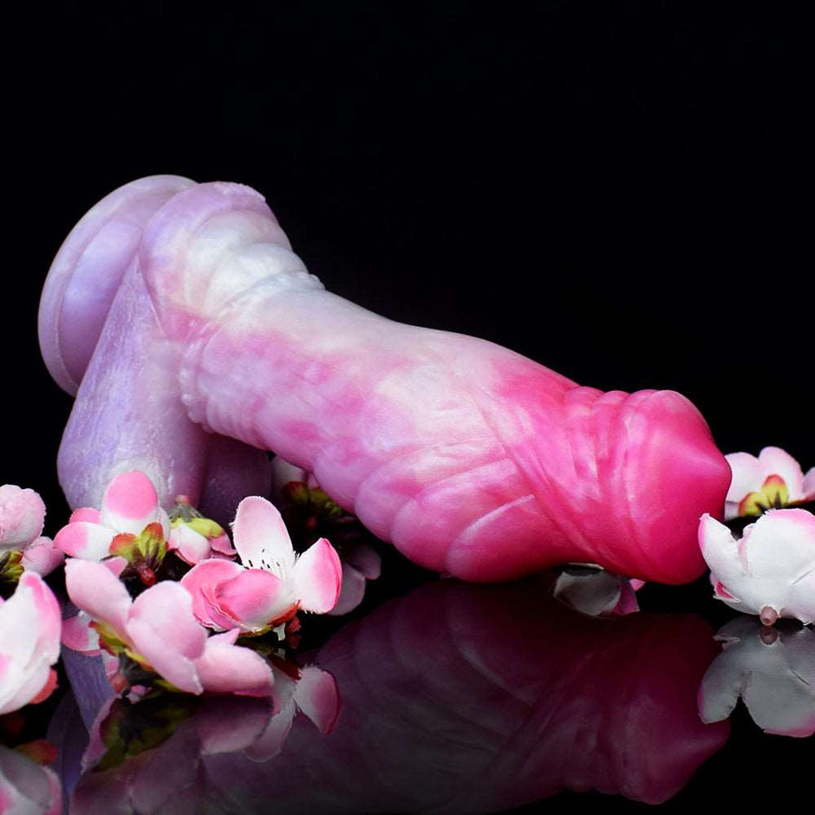 Curved ribbed unicorn dildo with tapered tip, translucent pink with purple accents