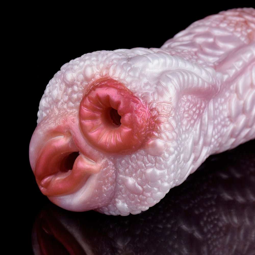 Cabezal de másturbador de dragón con dos aberturas ovaladas, color rosado y escamas