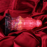 Alien butt plug with ribbed texture, dark purple tip and glossy pink body