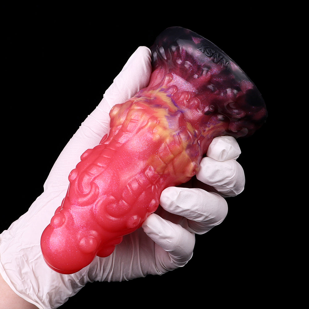 Ribbed alien butt plug, pink with purple base and colorful nebula spots
