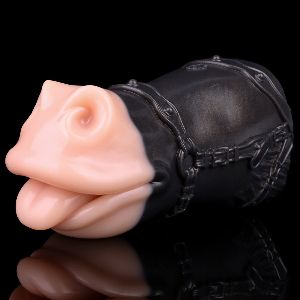 Animal muzzle sex toy close-up with pink nose insert on black leather-look muzzle