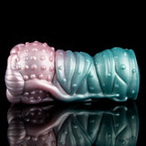 Alien Fleshlight with pink front, teal body, and raised bubble studs along the exterior.
