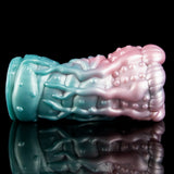 Long view of the alien Fleshlight showing pink head, teal shaft, and textured outer ridges.