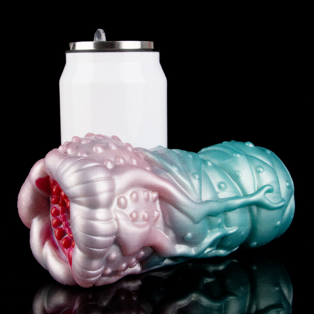 Pink-and-teal alien Fleshlight sleeve with ridged segments and glossy surface nubs.