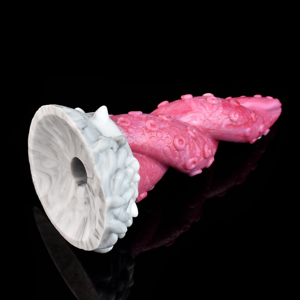 Pink octopus tentacle vibrator with large white suction-cup ring at base