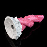 Pink octopus tentacle vibrator with large white suction-cup ring at base