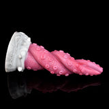 Pink octopus tentacle vibrator with flared tip and textured arms on white base