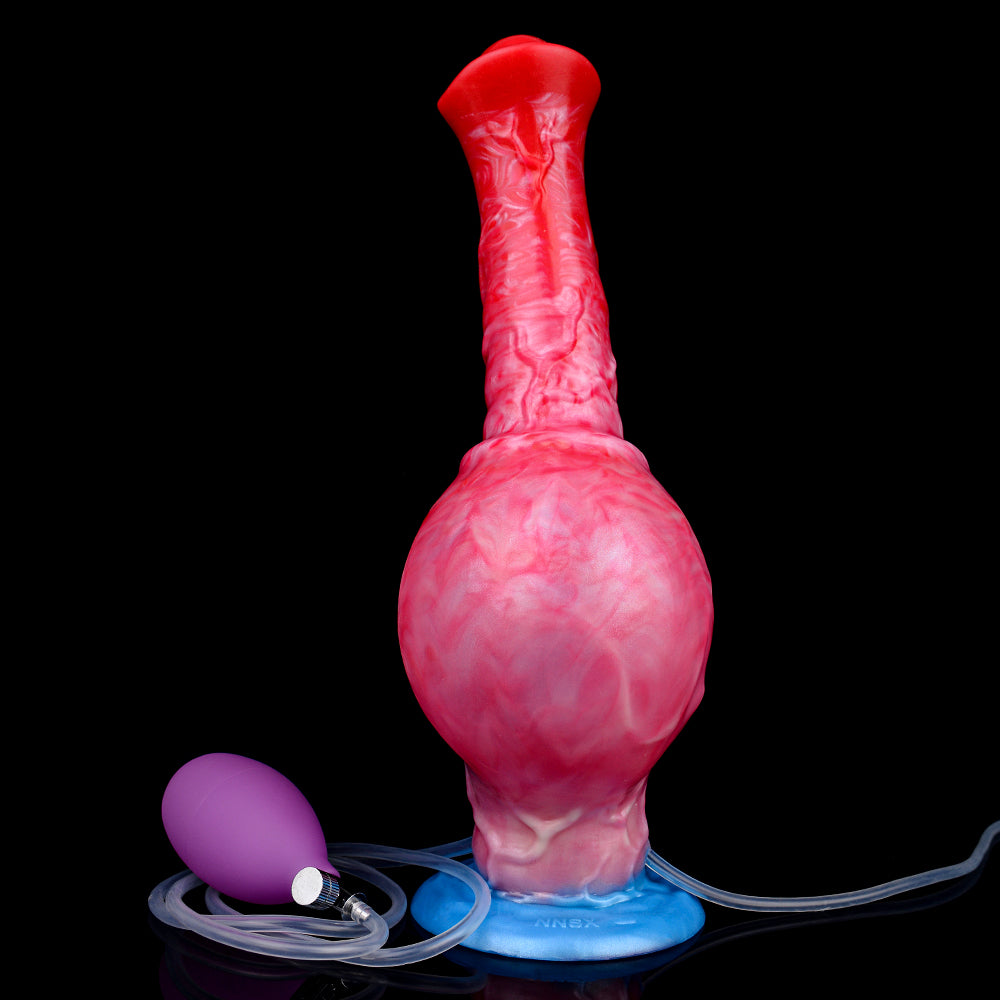 Inflatable horse toy with rounded red/pink body and blue base, hose attached