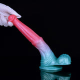 Hand holding horse-cock dildo, pink body with blue base and flared end