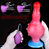 Inflatable fantasy-beast dog toy with valve and tubing, shown with gloved handling