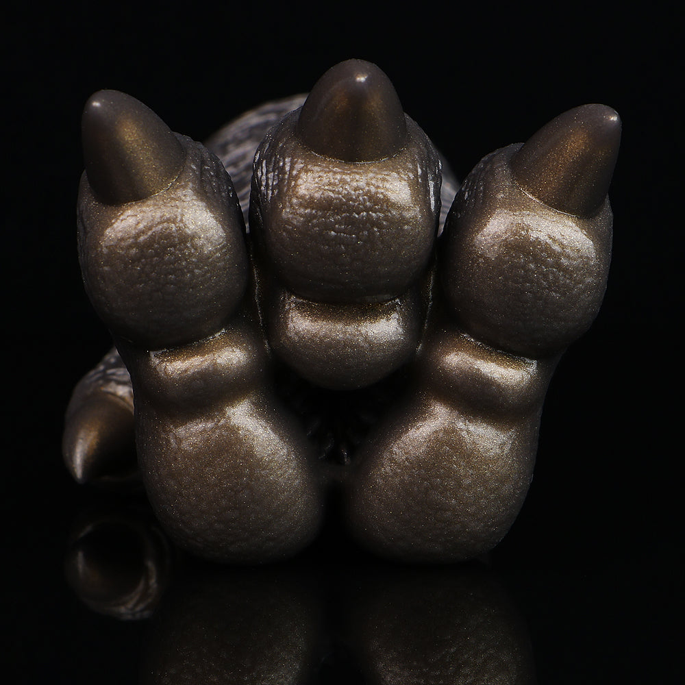 Bronze textured three-claw monster paw with raised pads and pointed tips