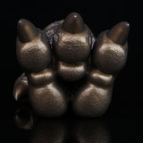 Bronze textured three-claw monster paw with raised pads and pointed tips