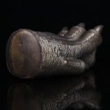 Bronze textured curled monster paw cover with ridged surface and rounded toes