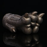 Bronze textured monster paw cover with ribbed pattern and rounded claw tips