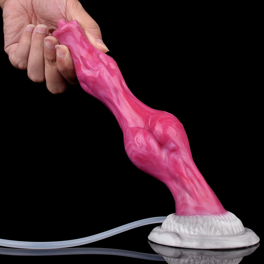 Pink translucent knot dildo in hand, white base with clear tube