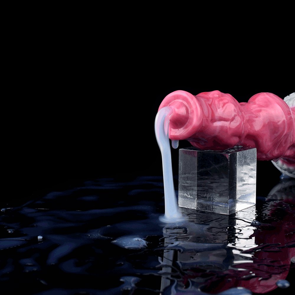 Pink translucent dildo with knot bulb end and clear nozzle tube