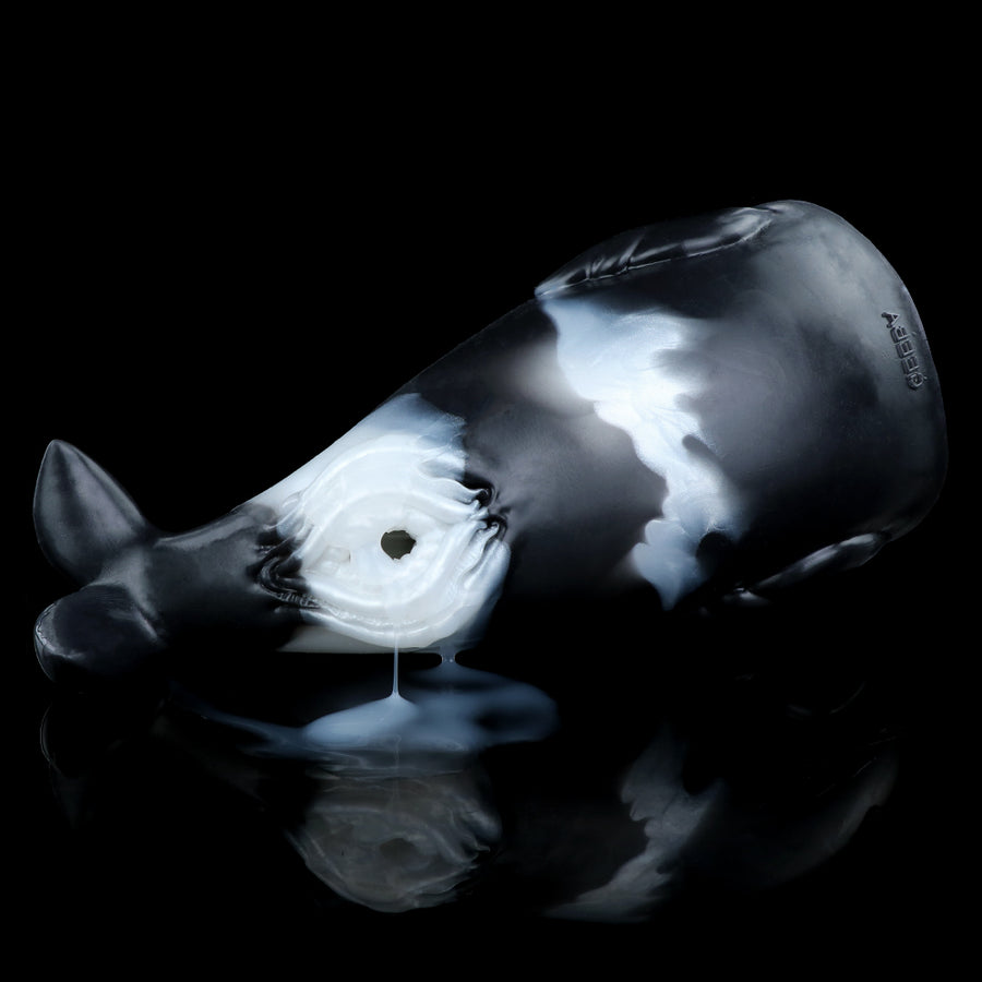 Whale-themed fleshlight sleeve with centered circular opening and textured surface