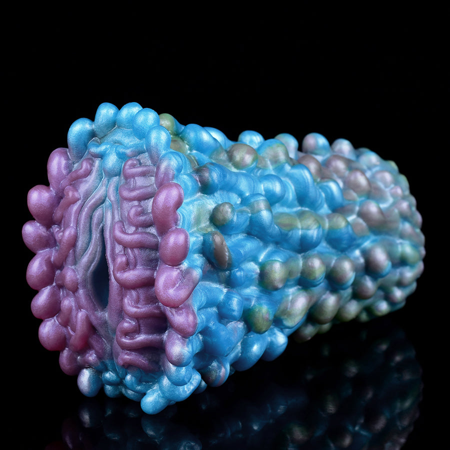 Kinky Chrysalis fantasy masturbator end view with raised alien nodules in blue and purple.