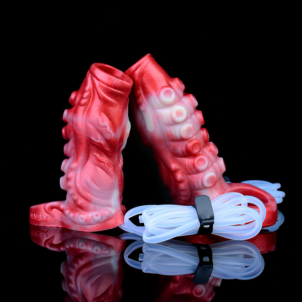 Back angle of red tentacle penis sheath with two clear tubes and connector straps