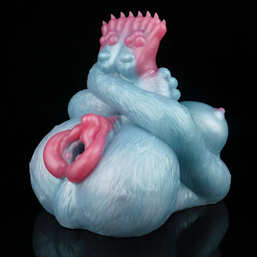 Light blue plush animal sex toy with raised pink crown and pink side opening