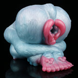 Blue plush-style animal Fleshlight with pink channel opening and curled ridged grip
