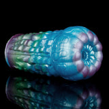 Alien fantasy male masturbator in blue with green and purple iridescent molded ridges