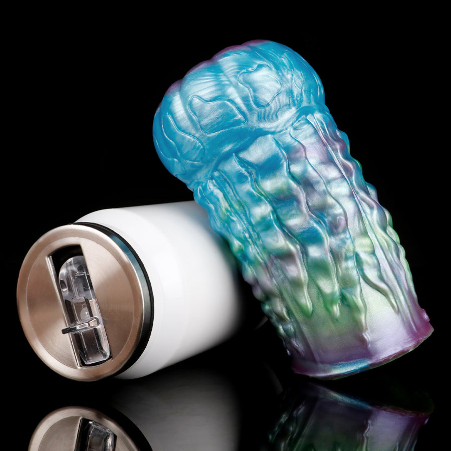 Alien-style male sex toy with open eye-like tip and iridescent blue ridged texture