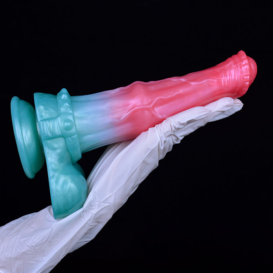 Horse-themed thick dildo in pink and teal attached with white cloth wrap