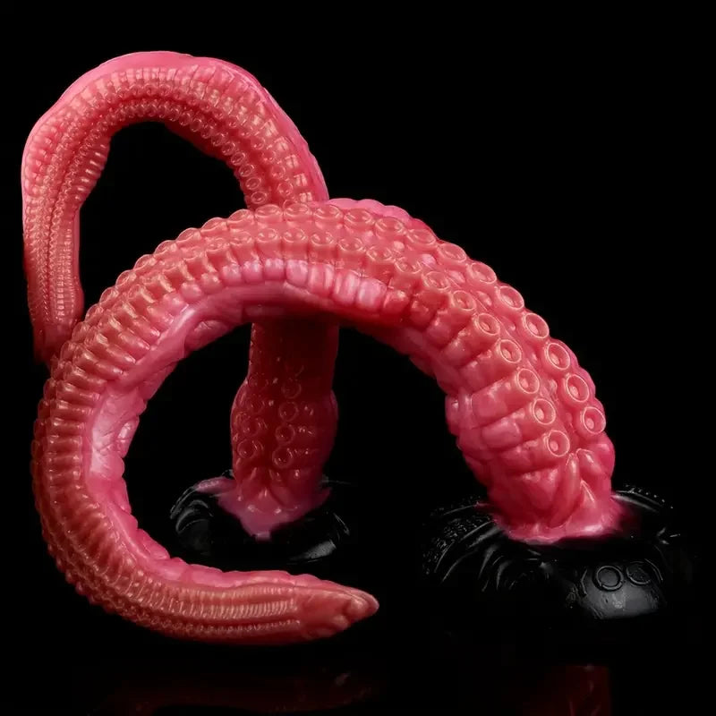 Tentacle dildo with ringed suction cups and curled base, deep pink/red color