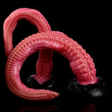 Tentacle dildo with ringed suction cups and curled base, deep pink/red color