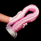 Rosa gebogenes Tentakel-Dildo mit genopptem Schaft und silberner Basis