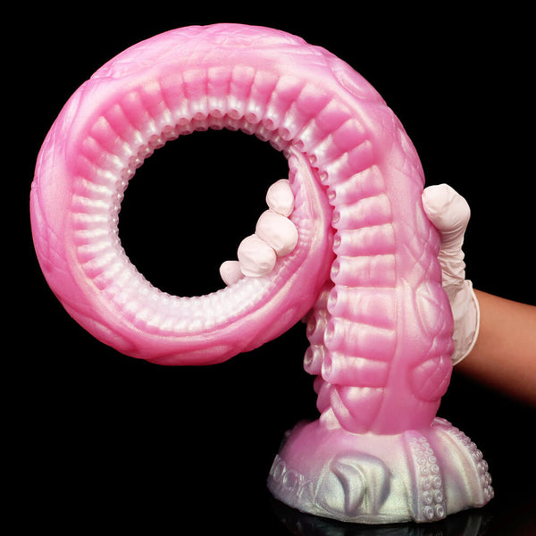 Pink giant tentacle dildo with curled loop, ribbed texture, and suction-like tips